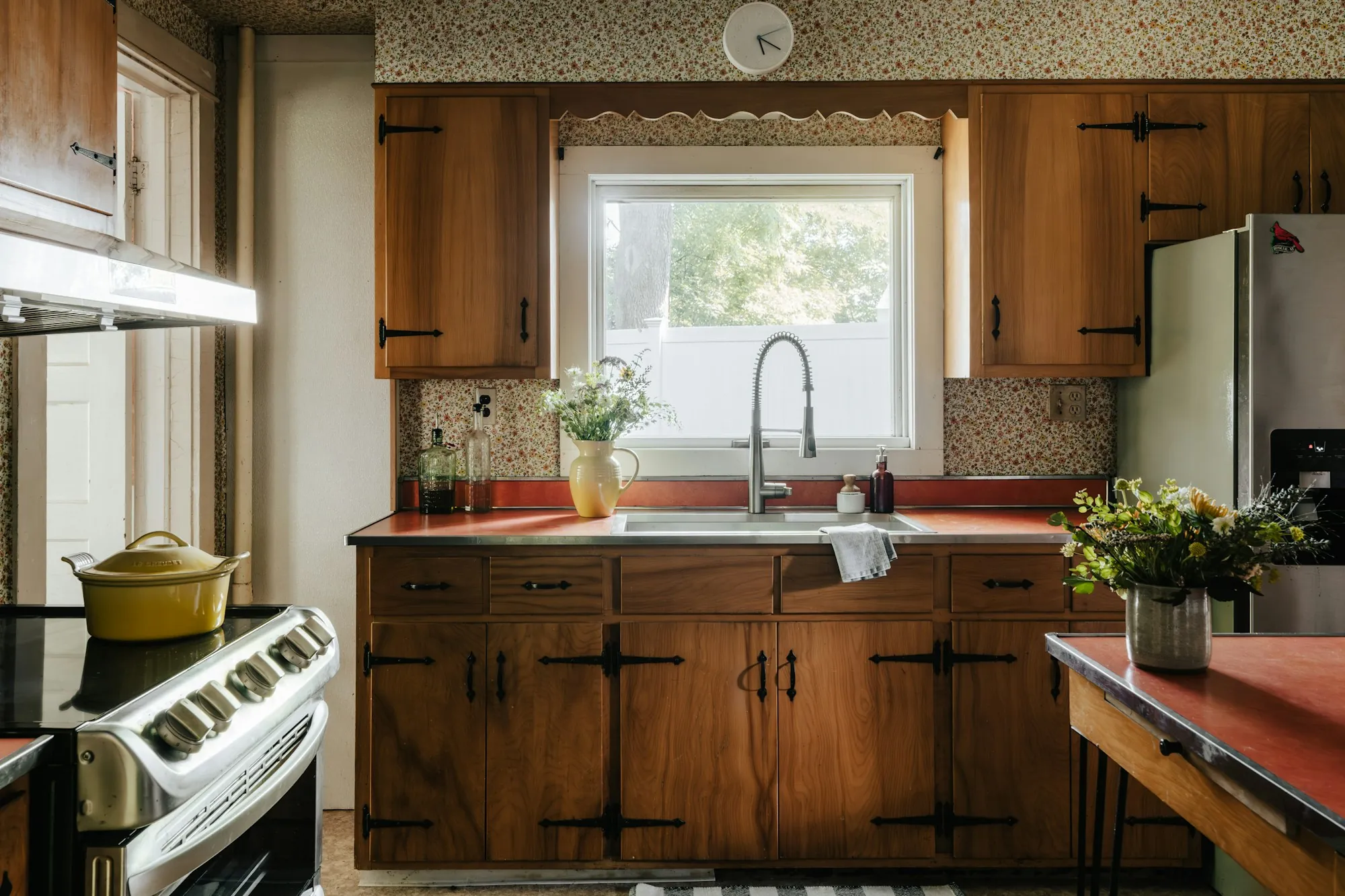 Water Filtration Services in Fountain Valley, CA Home kitchen with a sink under the window and wooden cabinets