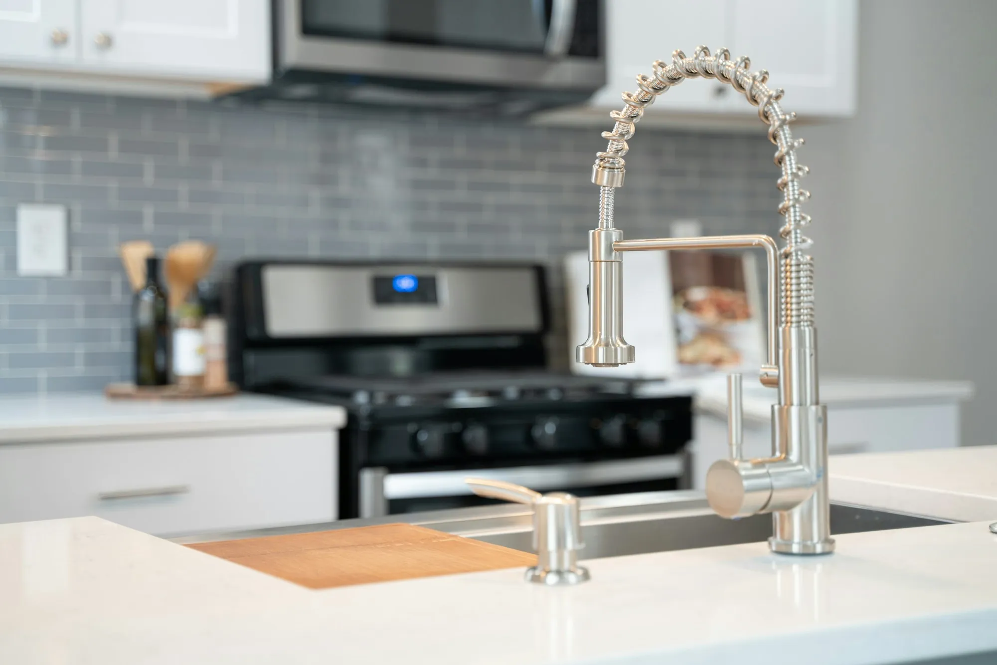 Stainless pull-down kitchen faucet over the sink