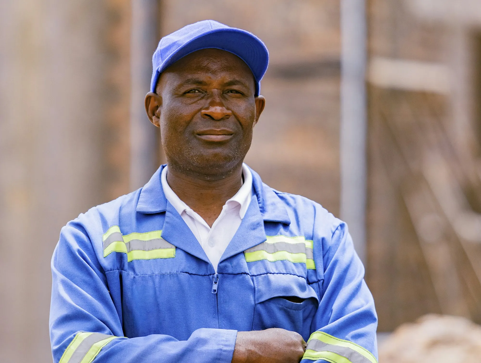 Smiling technician in a blue work uniform